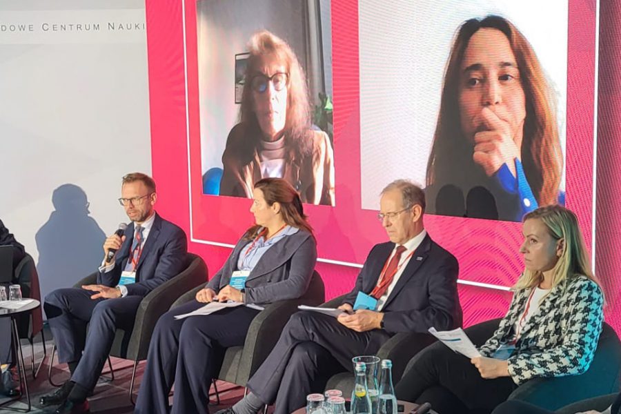 People on stage at a group discussion